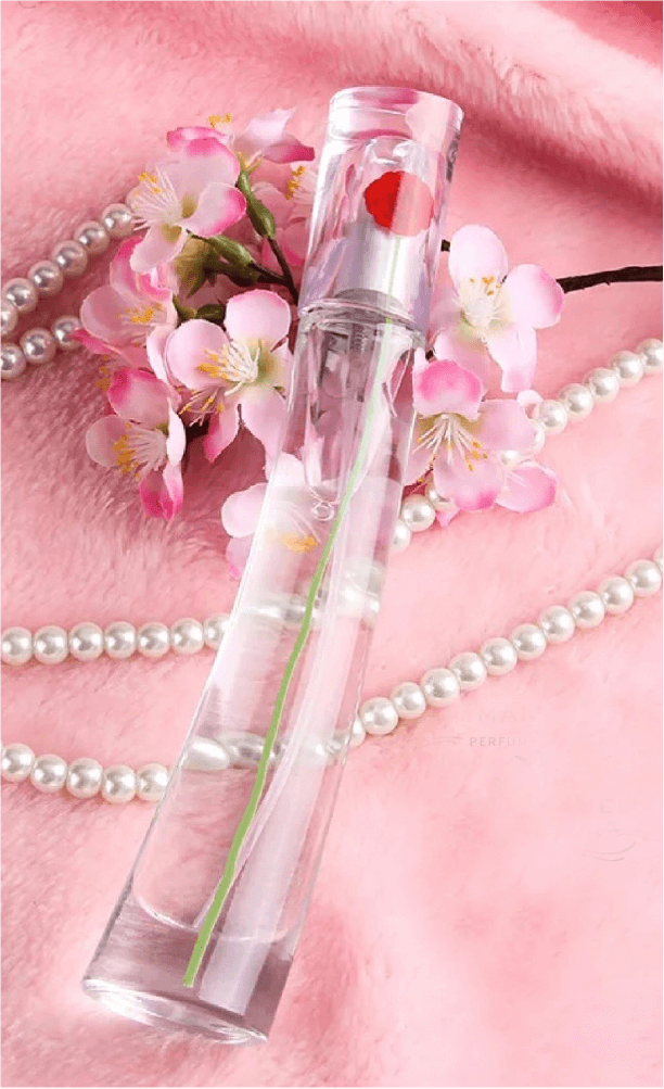 imagen de perfume con fondo rosa y perlas en formato vertical